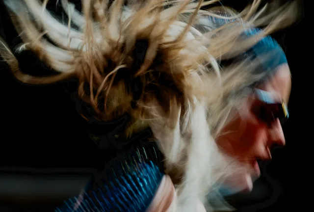 Motion-blurred athlete with flying hair at ATHLOS London 2026